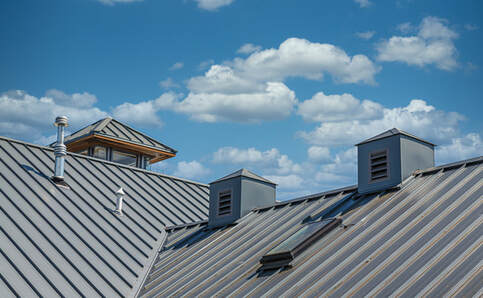 Freshly cleaned metal roof of a school in Round Rock TX